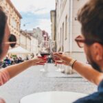 hostaria verona-genius-loci-couple-toasting-glasses-wine